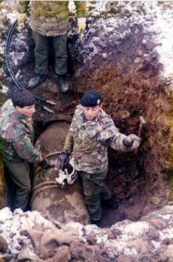 Royal Engineers Bomb Disposal experts diffusing Hermann 1,000kg bomb, Lancing Road which was dropped 12-13th December 1940 discovered during excavation work for drain laying 