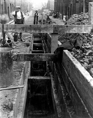 Laying Sewage Pipes in an unidentified Street