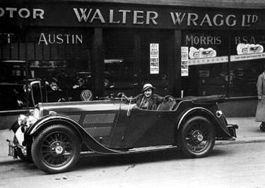 Car outside Walter Wragg Ltd., Motor Car, Motor Cycle Agent, Cycle Agent and Manufacturer 	