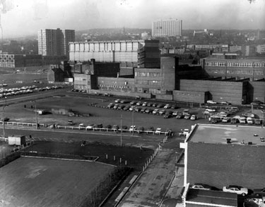 Elevated view of The Moor, Young Street and Bishop Street, looking towards Broomhall/Broomhill, No 55, Moore Street, Richards Bros. and Sons Ltd., cutlery manufacturers, right, Electric Sub-Station, Broomhall Flats and Hallamshire Hospital (back)