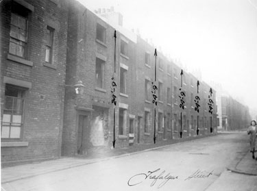 Back to back houses, Nos 142-124, Trafalgar Street, looking towards junction with Milton Street. Gas lamp at entrance to Court No. 7, left