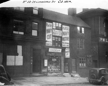 Nos. 21 - 25 Cambridge Street. No. 21 former Wellington Tavern, left, No. 23 Wm. Ord, confectioner and premises belonging to Percy W. Lacey (former St. Paul's School)