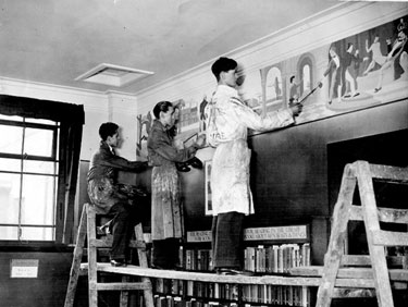 Three artists from the College of Arts painting the frieze at Hillsborough Junior Library, Hillsborough Library, Middlewood Road, Hillsborough Park. Formerly Hillsborough Hall and built in the 18th century.