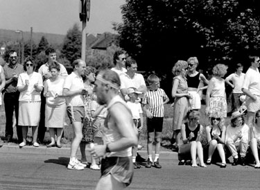Spectators watching competitors in the Sheffield Marathon pass through Parson Cross