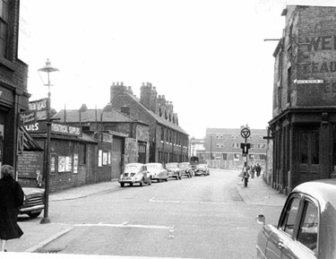 Button Lane at the junction with Rockingham Street showing former Wentworth House public house (later tailors premises) looking towards Nos 61-73 Sheffields' first Council Houses