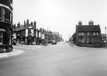 No. 528 Earl of Arundel and Surrey public house (extreme left), Queens Road at the junction with Bramall Lane/Harrington Road and Shoreham Street and St. Wilfred's R. C. Church extreme right 	