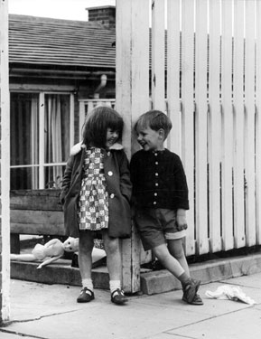 The Rendezvous- Two children laughing together, house suggested to be Raeburn Road, Herdings