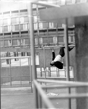 Boy at play on the Climbing Frame Park Hill Flats