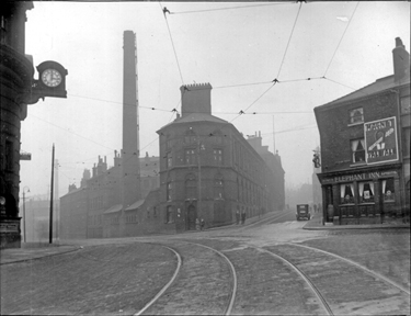 Junction of Flat Street (left) and Norfolk Street from Fitzalan Square, showing Joseph Rogers and Sons Ltd., cutlery manufacturers and No. 2, Elephant Inn with the clock on the General Post Office left
