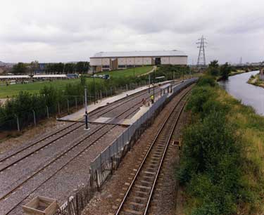 Sheffield Arena built for the World Student Games showing Don Valley Bowl, East End Park  and Steel Ladle with the U.K. Summer Special Olympics in progress (left) Supertram Tracks; Railway and Sheff and SYK Navigation