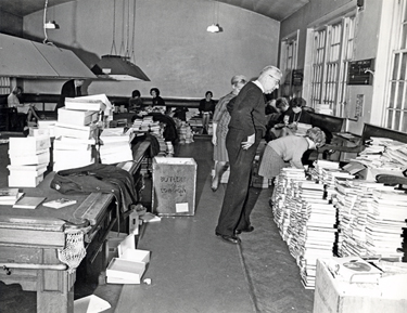 Librarians sorting a large amount of Library Books taken to Attercliffe Police Station, Whiworth Lane. 