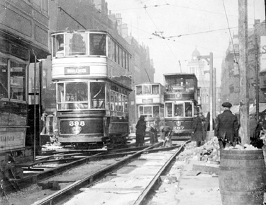 Laying or repairing tram tracks at Fargate looking towards Star and Telegraph Offices, 1920-1930's