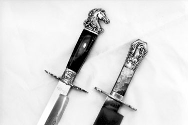19th century bowie knives with horse and alligator motif, displayed at the Cutlers' Hall