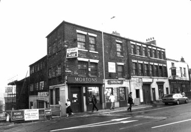 West Street at junction of Bailey Lane, showing Nos. 100 - 104 West Street, former premises of Morton Scissors, scissors manufacturers, No.100 Davidson and Co. (Steel Stamps) Ltd., mark makers and No. 94 Saddle Inn