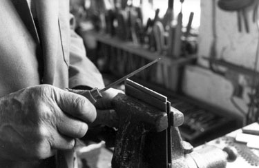 Demonstrating filework (workbacking) for decorating pocket-knives at Stan Shaws, No. 48 Garden Street