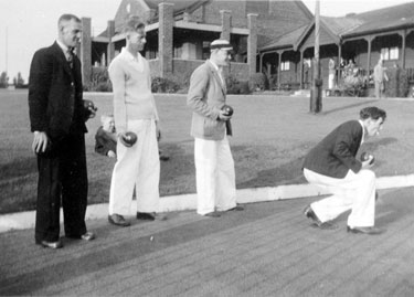 Bill Jarvis, Matt Cooke, Frank Smith and George Bradley bowling at E.S.C. Sports Ground with the Pavilion and changing pavilion in the background