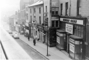 Elevated view of Nos. 4, vacant premises of Philip Cann, music seller; 6, H. C. Sayer, butcher; 8, S. M. Parry, fruitiers, 10, Foam Shop, rubber cushion dealers, Dixon Lane
