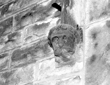 Carved head in Crookes cemetery
