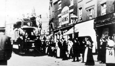 The maiden trip of Sheffield's first electric tram car (No. 1), on South Street, Moor, outside Nos. 9 - 11 Devonshire Arms public house