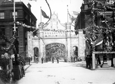 Decorative arch at the top of Commercial Street to celebrate Queen Victoria's visit, photographed from High Street. General Post Office, Haymarket, left