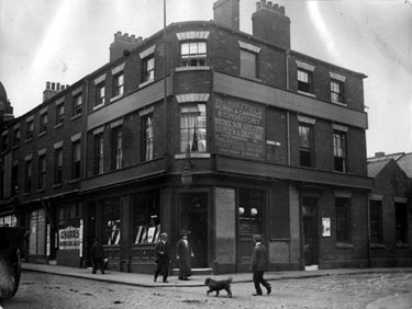 Newmarket Inn, Nos. 11 - 13 Exchange Street (left) and No. 1 Castle Hill (right), note advertisement pointing to the The Sheffield Horse and Carriage Repository owned by Nicholson, Greaves, Barber and Hastings, auctioneers