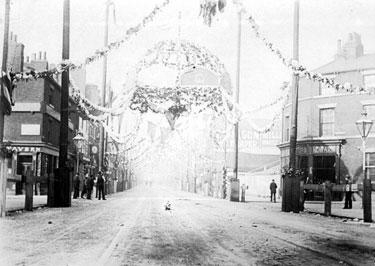 Decorations for Queen Victoria's visit, South Street, Moor at junctions with Earl Street and Rockingham Street, No. 79 Pump Tavern, left, No 74, Howard Brothers, butchers, right