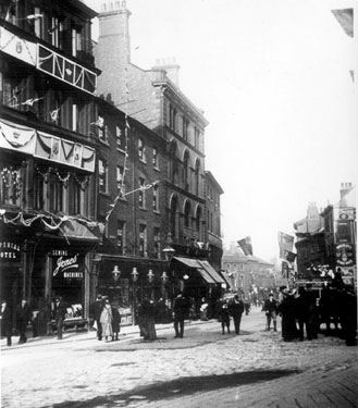 Castle Street on Coronation Day, (premises include, left to right), No. 3 Jones' Sewing Machine Co. Ltd., sewing machine manufacturers, Nos. 5 and 7 William Hy. Naylor, confectioner, Nos. 13 - 15 Waverley Temperance Hotel