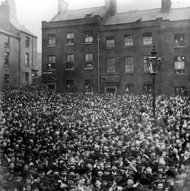 Paradise Square, mass political meeting, from the balcony of the Middle Class School. Properties in background include No 1, House of Help for Girls and Young Women, No 3, John Heiffor, razor manufacturer