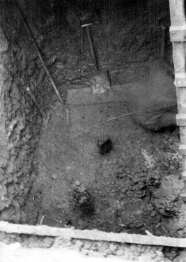 Sheffield Castle excavations recorded by J.B. Himsworth. Excavations in middle of moat showing two wooden props or stakes