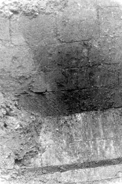 Sheffield Castle excavations recorded by J.B. Himsworth. Part of the central face and plinth course of Bastion Tower