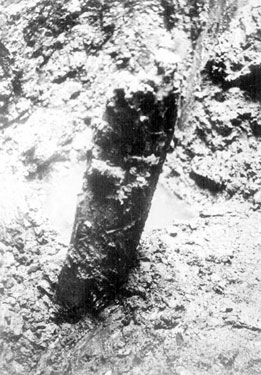Sheffield Castle excavations recorded by J.B. Himsworth. Oak prop or stake, about 5 1/2 foot long, found in middle of excavated moat