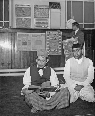 Salah Sifyan and Wali Mohammed celebrate the end of Ramadan at the newly opened Jamia Mosque, Bodmin Street; housed in the former Wesleyan Reform Church this replaced the Mosque on Industry Road