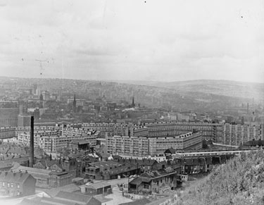 View from Skye Edge across Park Hill Flats, showing C and A Reed, funeral directors, No. 173, Duke Street; Park Library and Baths (chimney left); Talbot Street Methodist Church (left between blocks of the Flats) looking towards the City Centre