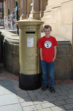 Post box painted gold to commemorate Jess Ennis gold medal at London 2012 Olympics