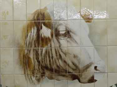 Cow mural on wall tiles during the last days of Castle Market 