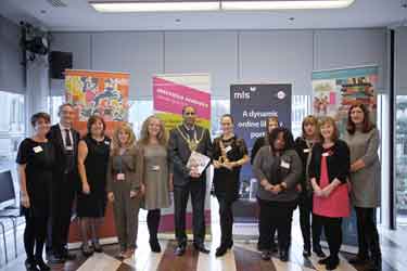 Children's author, Lara Williamson (7th left) and Lord Mayor, Councillor Talib Hussain (6th left) at the Sheffield Children's Book Award, with organising staff from Sheffield Libraries and Information Services 
