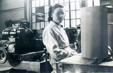 Elsie Lane at her machine at Stalker Drill Works, Langsett Road, Sheffield during World War Two