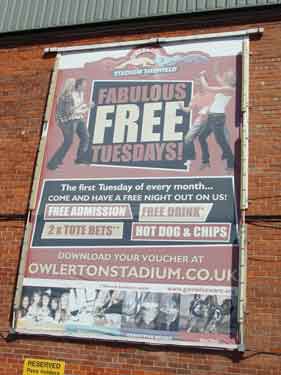 Advertising hoarding in car park of Owlerton Stadium, Penistone Road
