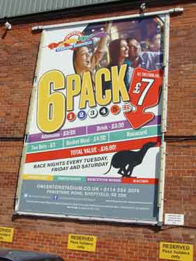 Advertising hoarding for greyhound racing nights in car park of Owlerton Stadium, Penistone Road