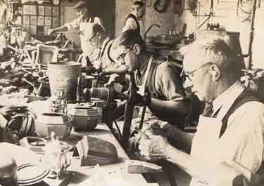 F. Drury (Silversmiths) Ltd., Edwin Speight, foreground, Jack Drury, Arthur Makepace and Bert Jefferies at work in the silver shop at Leah’s Yard. 