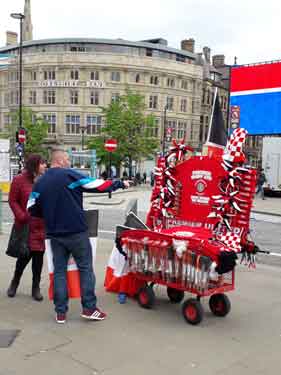 Street seller during the celebrations for Sheffield United Football Club being promoted to the premier league