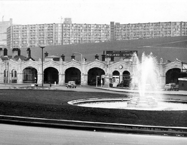 Sheffield Midland railway station, Sheaf Street  after cleaning with Sheaf Square fountain in the foreground and Park Hill Flats inm the background
