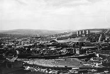 View over (bottom left) of Canal Basin (Victoria Quays) showing (top right) Woodside and Pye Bank Flats, Pitsmoor and (left) Netherthorpe 
