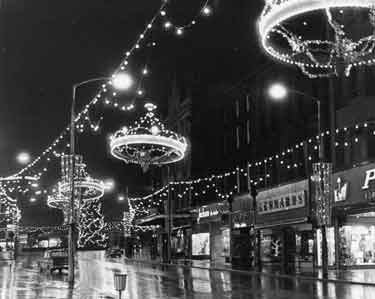Christmas illuminations, Fargate showing 20 - 26 Proctors Ltd., house furnishers; Nos. 28 - 30 Lennards Ltd., shoe retailers and Nos. 34 - 36 Jackson the Tailor