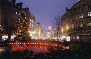 Christmas illuminations at the Goodwin Fountain, Fargate showing Yorkshire Bank on right and Dixons Ltd., photographical equipment; audiovisual and electronics store on left