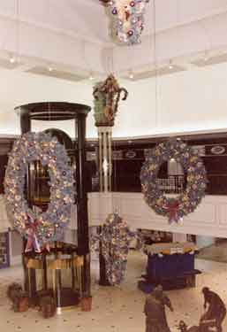 Christmas decorations, Upper Mall, Meadowhall Shopping Centre, Meadowhall showing Crucible Teemers sculpture on the right and customer lift  