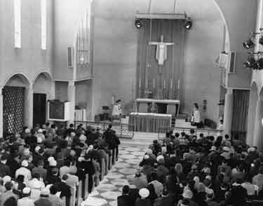 Service inside St. Theresa's Roman Catholic Church, junction of Prince of Wales Road and Queen Mary Road, Manor