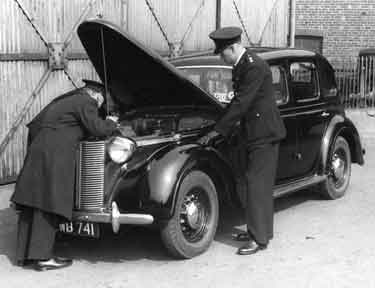 Police work - Policemen checking under the bonnet of a taxi, Sheffield City Police