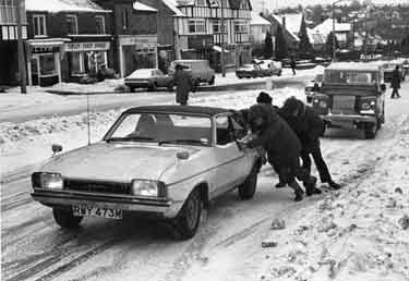 Helping a motorist on Totley Rise, Baslow Road during snow