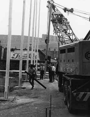 Football World Cup 1966: erecting flag poles outside Sheffield Midland railway station, Sheaf Street